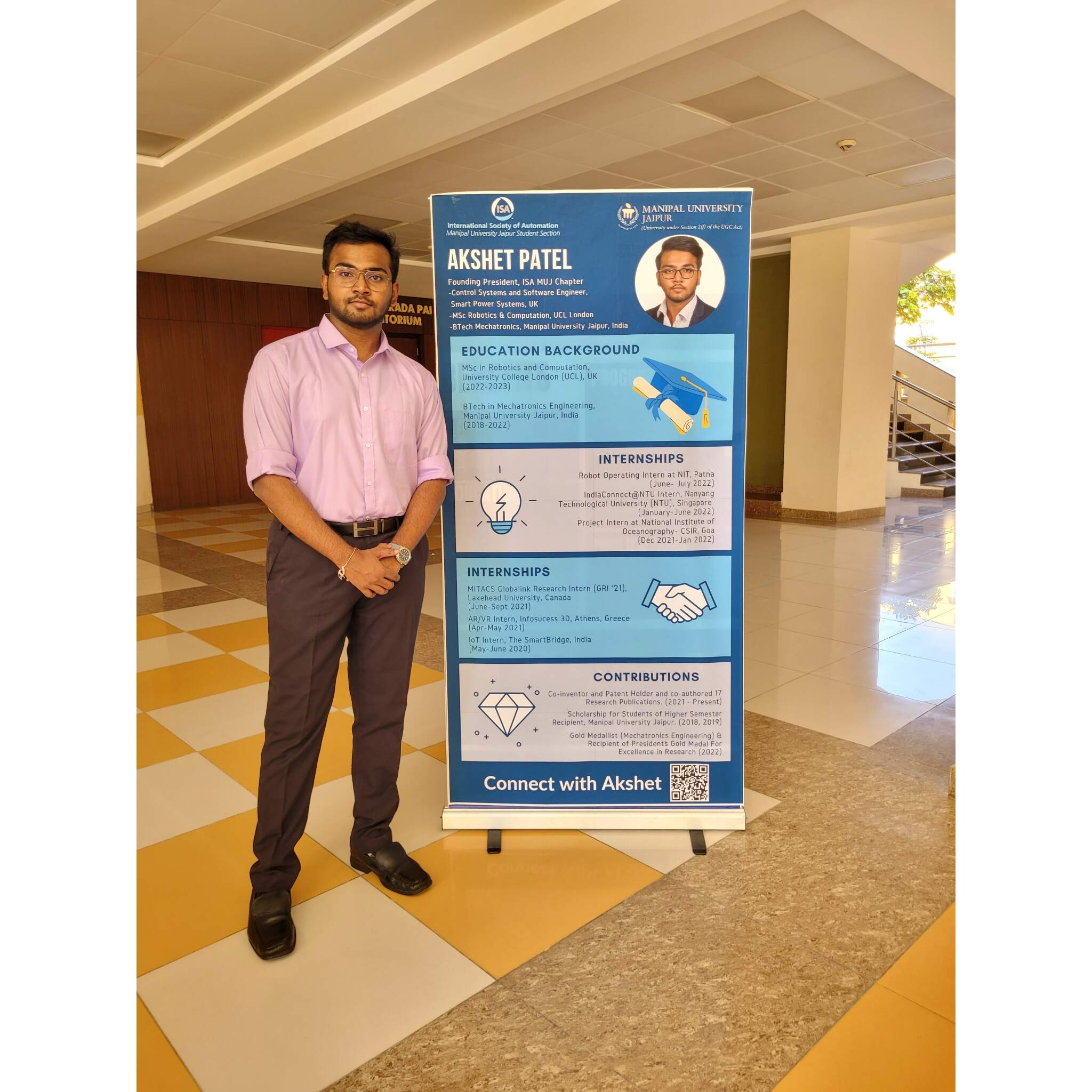 Akshet Patel with achievement banner