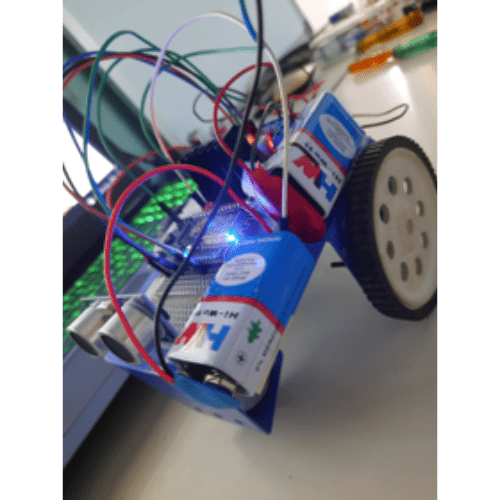 Battery-powered wheeled robot prototype with exposed wiring