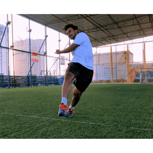 Akshet Patel playing football on an indoor pitch