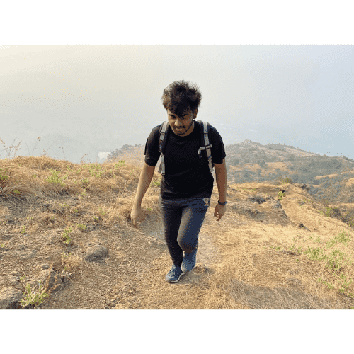 Akshet Patel hiking on a dry hillside
